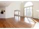 Bright living room with vaulted ceiling, fireplace, and large window letting in lots of light at 2322 Norbury Se Cv, Smyrna, GA 30080