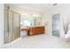 Spacious bathroom with a shower, vanity, tile flooring and a walk-in closet at 2322 Norbury Se Cv, Smyrna, GA 30080