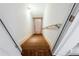 Staircase leading downwards, featuring painted steps and walls, and a handrail for safety at 2322 Norbury Se Cv, Smyrna, GA 30080