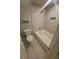 Bathroom features a tub, toilet and granite tile walls at 3777 Peachtree Ne Rd # 1324, Brookhaven, GA 30319