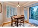 Cozy dining area with table, chairs, and access to an outdoor balcony with scenic views at 3777 Peachtree Ne Rd # 1324, Brookhaven, GA 30319