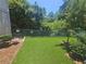 Community dog park, a fenced green space with seating, providing a dedicated space for pets to exercise at 3777 Peachtree Ne Rd # 1324, Brookhaven, GA 30319