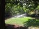Serene green space featuring an irrigation system on a lush lawn, ideal for relaxation at 3777 Peachtree Ne Rd # 1324, Brookhaven, GA 30319