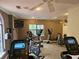 Home gym featuring StarTrac treadmills, elliptical machines, and a wall-mounted TV at 3777 Peachtree Ne Rd # 1324, Brookhaven, GA 30319