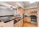 Bright kitchen featuring stainless steel appliances, mosaic backsplash, bar seating and modern countertops at 3777 Peachtree Ne Rd # 1324, Brookhaven, GA 30319