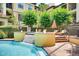 Inviting pool with a tanning ledge, surrounded by lush trees and lounge seating at 3777 Peachtree Ne Rd # 1324, Brookhaven, GA 30319