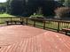 A red wooden deck features built-in seating and a railing at 2500 Woodward Rd, Atlanta, GA 30349
