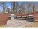 This backyard features a grill station with an assortment of grills and a stained wooden fence at 3739 Newhalem Sw St, Atlanta, GA 30331
