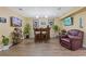 Finished basement features a wet bar, bar seating, and a comfortable armchair at 3739 Newhalem Sw St, Atlanta, GA 30331