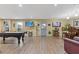 Spacious basement area is great for entertaining and includes a pool table and multiple televisions at 3739 Newhalem Sw St, Atlanta, GA 30331