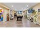 Finished basement offers ample space for leisure activities, featuring a pool table at 3739 Newhalem Sw St, Atlanta, GA 30331