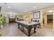 Finished basement offers a pool table, a wet bar and additional seating, perfect for entertaining at 3739 Newhalem Sw St, Atlanta, GA 30331