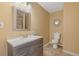 This bathroom features a modern vanity and a toilet, all with a clean, functional design at 3739 Newhalem Sw St, Atlanta, GA 30331