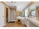 Bright bathroom with a shower, bathtub, double sinks, and vanity area at 3739 Newhalem Sw St, Atlanta, GA 30331