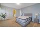 Clean bedroom features a new mattress on a bed frame and a blue accent wall at 3739 Newhalem Sw St, Atlanta, GA 30331