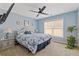 Bright bedroom featuring a ceiling fan and large windows at 3739 Newhalem Sw St, Atlanta, GA 30331