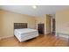 Spacious bedroom has beautiful wood floors and a comfortable bed at 3739 Newhalem Sw St, Atlanta, GA 30331