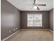 Bedroom with neutral walls, large window and carpeted floor at 3739 Newhalem Sw St, Atlanta, GA 30331