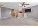 Loft bonus room features a ceiling fan, mounted tv and neutral colors at 3739 Newhalem Sw St, Atlanta, GA 30331