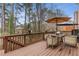 This deck features a table and chairs, ideal for enjoying scenic views and outdoor dining at 3739 Newhalem Sw St, Atlanta, GA 30331