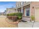 Inviting front porch of a brick home, featuring a decorated door and manicured landscaping at 3739 Newhalem Sw St, Atlanta, GA 30331