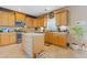 Bright eat-in kitchen with a central island and stainless steel appliances at 3739 Newhalem Sw St, Atlanta, GA 30331