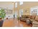 Spacious living room with high ceilings, large windows, and hardwood flooring at 3739 Newhalem Sw St, Atlanta, GA 30331