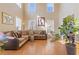 Sunlit living room with high ceilings, hardwood floors, and comfortable seating area at 3739 Newhalem Sw St, Atlanta, GA 30331