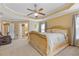 Large main bedroom with tray ceilings, seating area, and access to the main bathroom at 3739 Newhalem Sw St, Atlanta, GA 30331