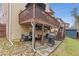 This home features a patio with seating and stone flooring beneath a porch, great for entertaining at 3739 Newhalem Sw St, Atlanta, GA 30331