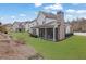 This home features a large backyard with a sunroom at 4681 Gablestone Dr, Hoschton, GA 30548