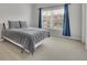 Bedroom with a large window for natural light, and carpet at 4681 Gablestone Dr, Hoschton, GA 30548