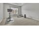 Bonus room set up as a gym with exercise equipment and natural light at 4681 Gablestone Dr, Hoschton, GA 30548