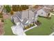 Beautiful two-story home with a manicured lawn, professional landscaping, and three-car garage on a spacious lot at 4681 Gablestone Dr, Hoschton, GA 30548
