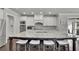 Gourmet kitchen boasting a large island, stainless steel appliances, and stylish backsplash at 4681 Gablestone Dr, Hoschton, GA 30548