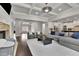 Comfortable open-concept living room with hardwood floors and stone fireplace at 4681 Gablestone Dr, Hoschton, GA 30548