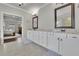 This is a main bathroom with double sinks and granite countertops at 4681 Gablestone Dr, Hoschton, GA 30548