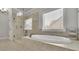 This main bathroom features a glass shower and soaker tub at 4681 Gablestone Dr, Hoschton, GA 30548