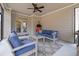 This is a sunroom with comfortable seating and lots of natural light at 4681 Gablestone Dr, Hoschton, GA 30548
