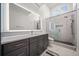 Modern bathroom features a sleek vanity, and a glass-enclosed shower with updated tile at 5655 Cross Gate Dr, Atlanta, GA 30327