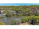 Aerial view of lake and apartment complex in a treed area at 1026 Riverbend Club Se Dr, Atlanta, GA 30339