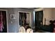 Bedroom with closets, dark curtains, and an old fan at 1026 Riverbend Club Se Dr, Atlanta, GA 30339