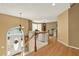 Foyer with hardwood floors, chandelier, and white wood railing at 1074 Fieldstone Dr, Canton, GA 30114