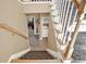 Carpeted staircase with wooden handrail at 1074 Fieldstone Dr, Canton, GA 30114