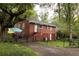 A charming, fenced-in brick home with a lush green backyard at 2413 Hillside Ave, Decatur, GA 30032
