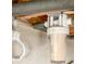 Water filter system hanging on basement walls with exposed pipes at 2413 Hillside Ave, Decatur, GA 30032