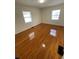 Bedroom with two windows and gleaming hardwood floors at 2413 Hillside Ave, Decatur, GA 30032