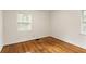 The bedroom is light and bright with two windows and hardwood floors at 2413 Hillside Ave, Decatur, GA 30032