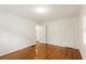 An empty bedroom features freshly painted walls and hardwood flooring at 2413 Hillside Ave, Decatur, GA 30032