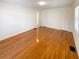 Bright bedroom featuring gleaming hardwood floors and two closets at 2413 Hillside Ave, Decatur, GA 30032